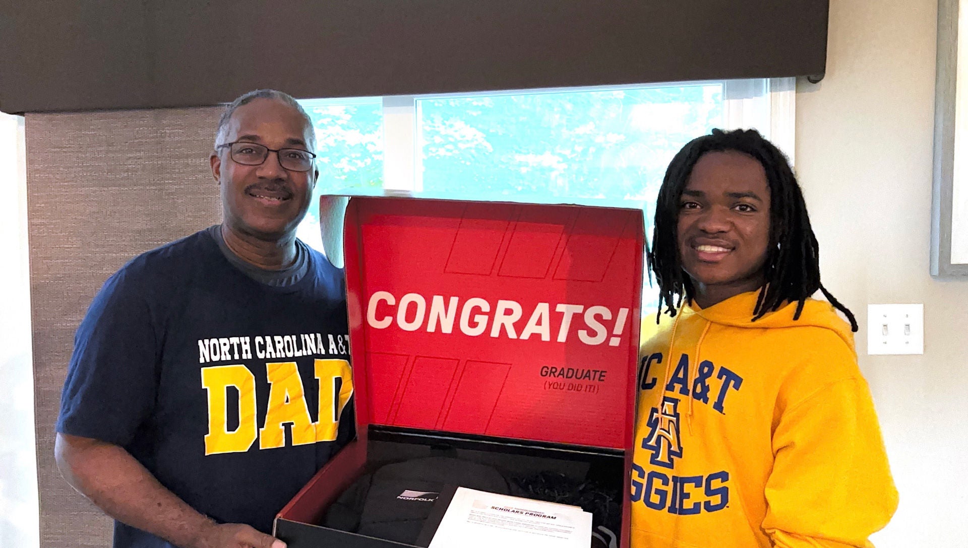 Justin Mathews with his father