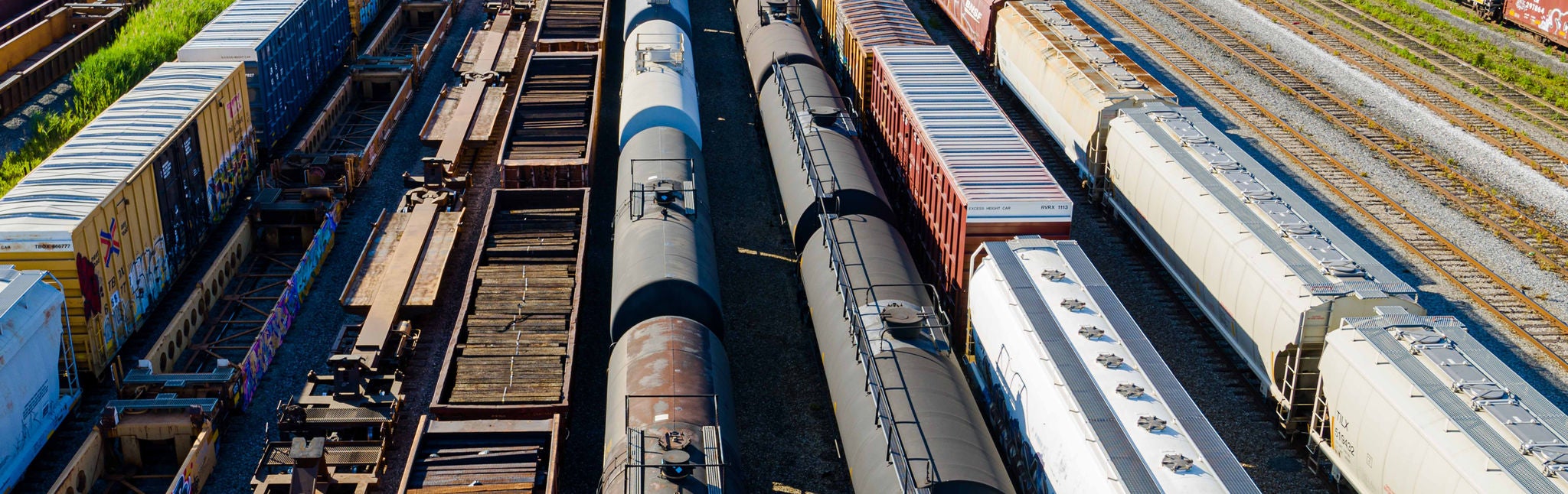 Line of train cars in a train yard ready for chemicals transported by rail