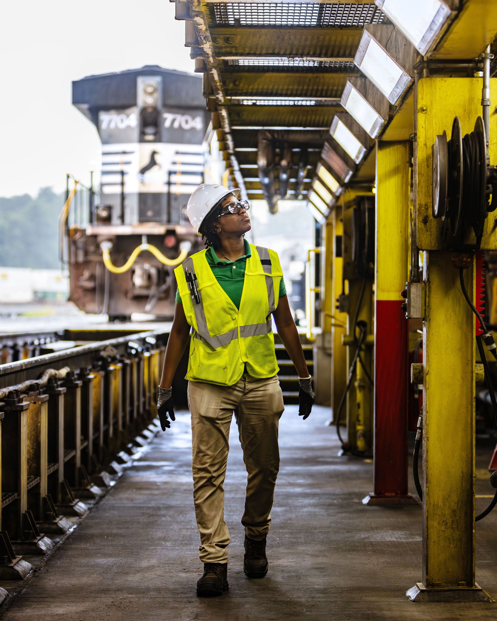 Norfolk Southern employee walking under a railway to help further their customer centric strategy