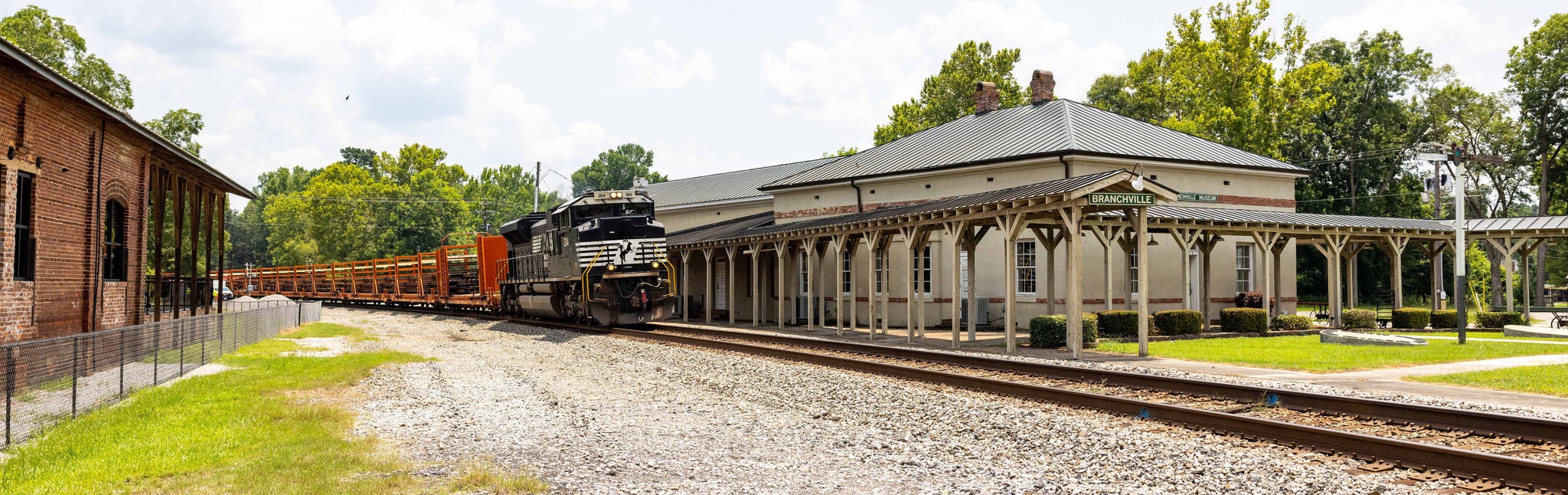 Train moving through historic train yard in a way that promotes community safety.