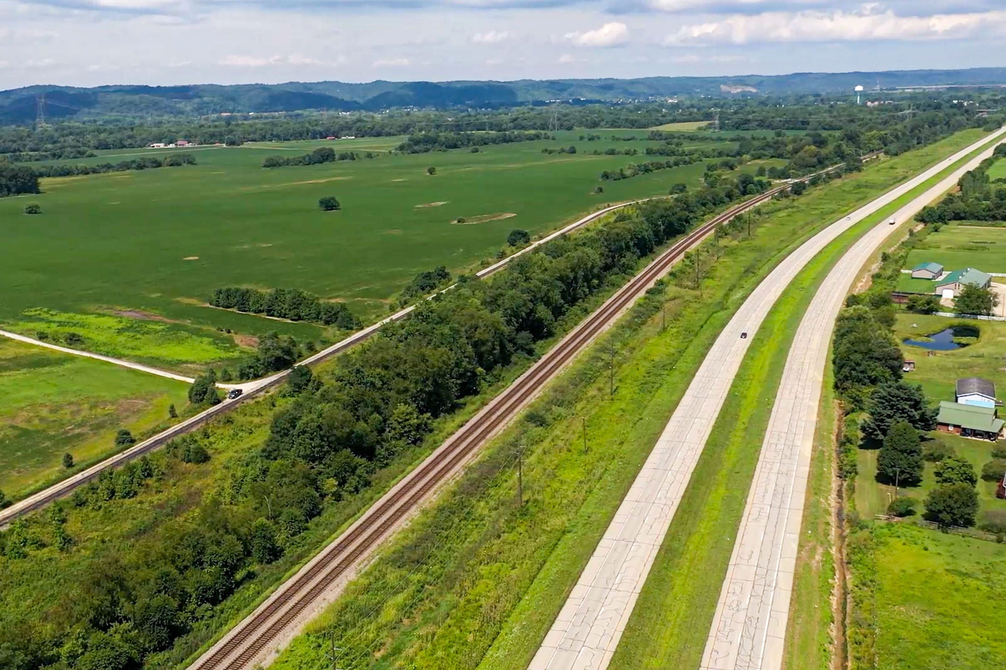 Road tracks near ohio river megasite industrial development Highway and train tracks next to Ohio River Megasite, a potential spot for industrial development