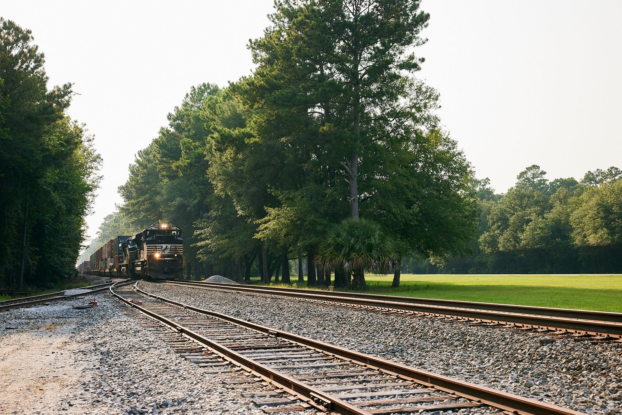 A Thoroughbred train carrying export locomotives bound for,Mozambique, Africa, winds through an S-curve near Huntingdon, Pa.