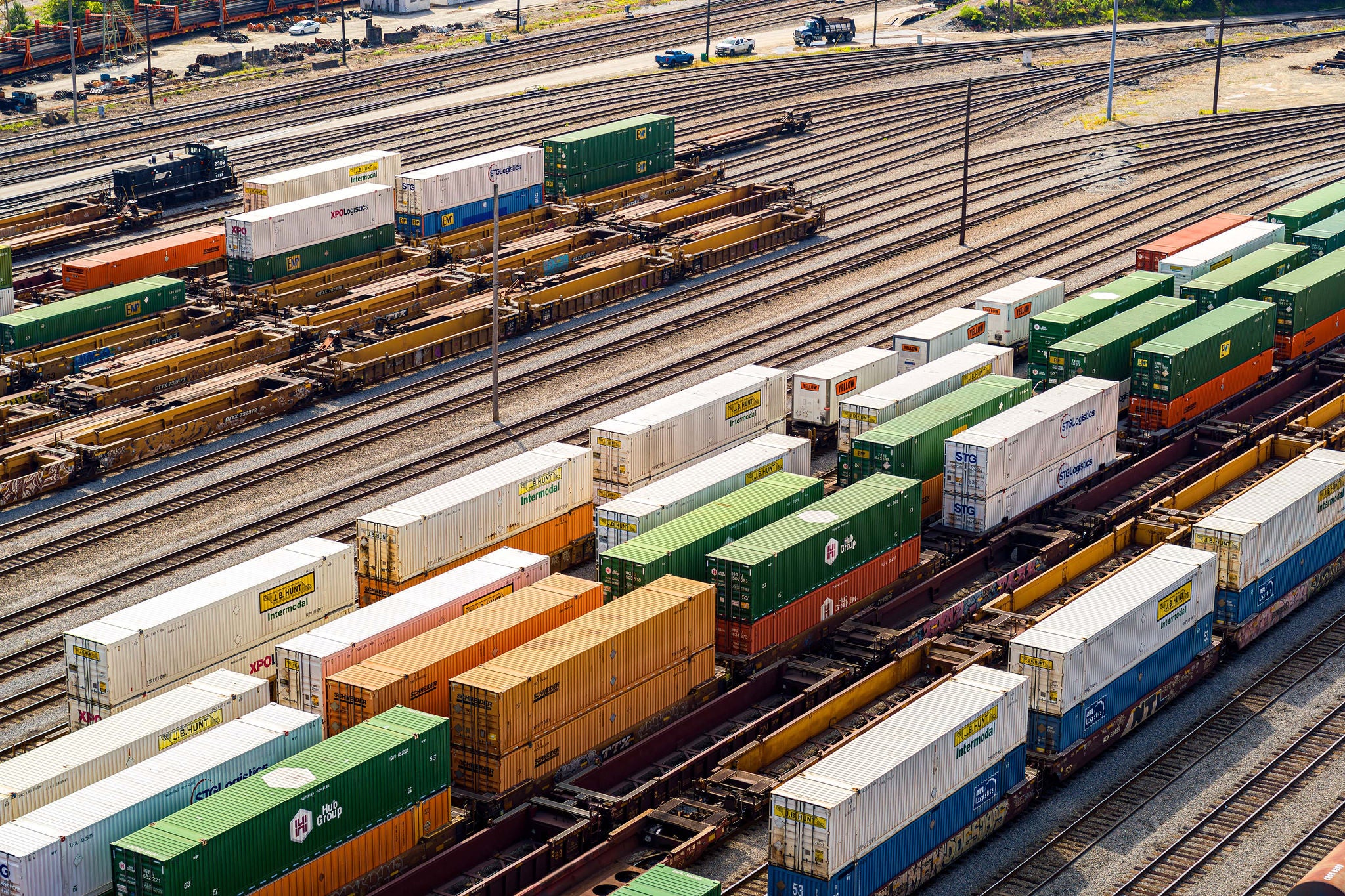 An aerial shot of dozens of intermodal shipping containers parked on Norfolk Southern’s rail lines.