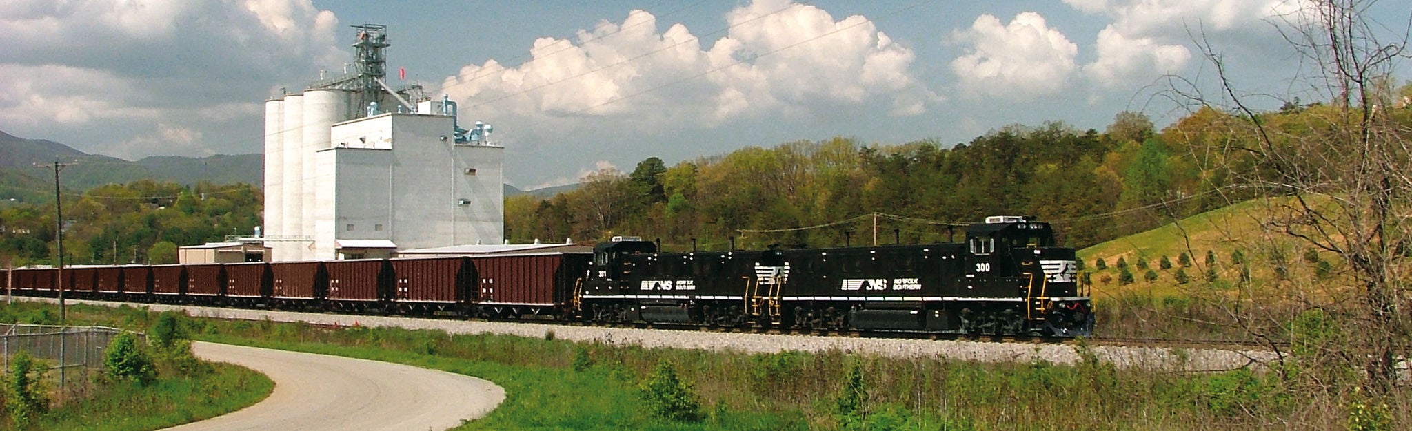 Genset energy efficient train cars pulling grain cars