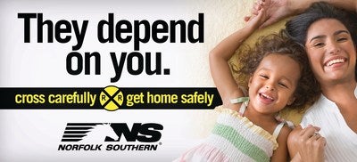 Cross tracks safely. They depend on you. (PRNewsFoto/Norfolk Southern Corporation)
