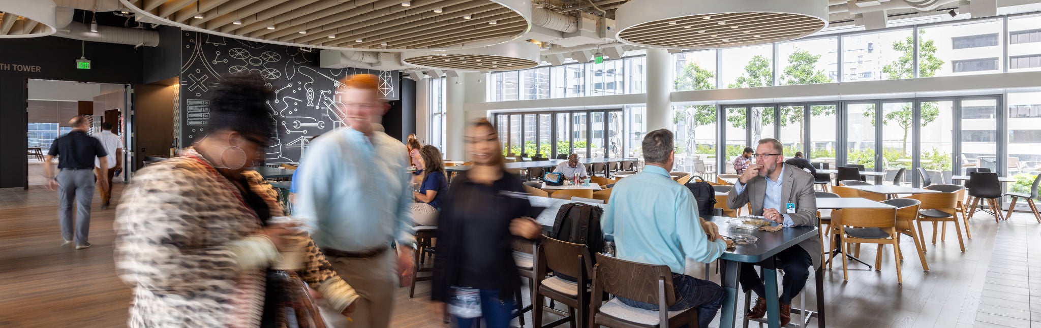 Group of people moving through railroad industry leaders Norfolk Southern’s lunchroom  