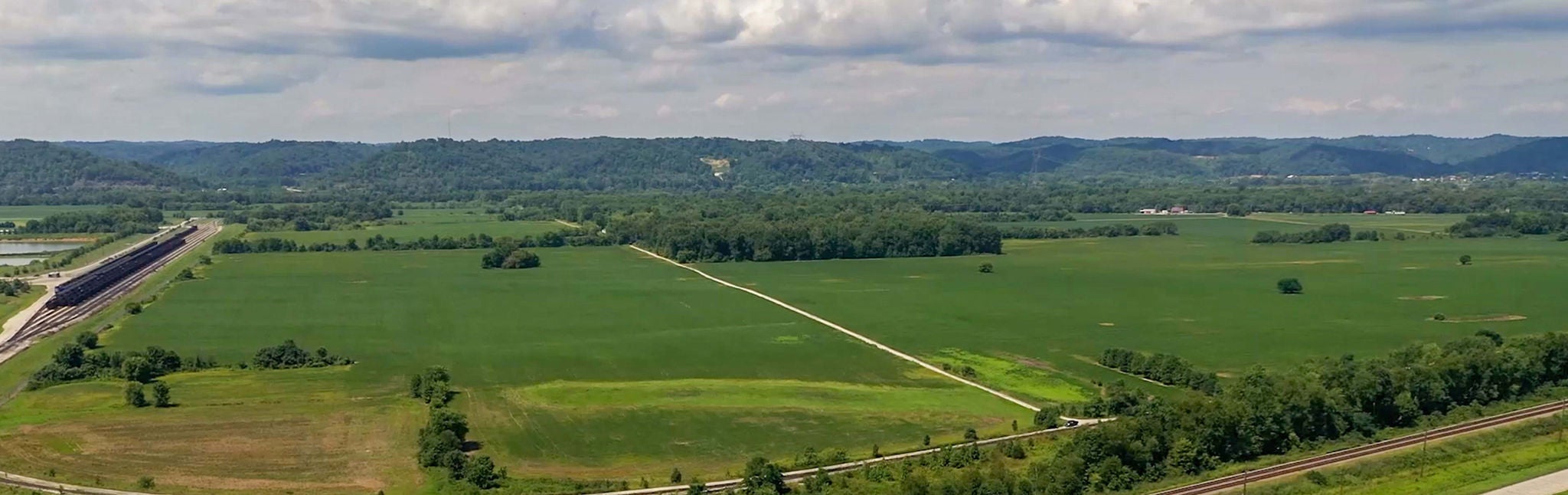 Aerial view of a green field that could be industrial developed