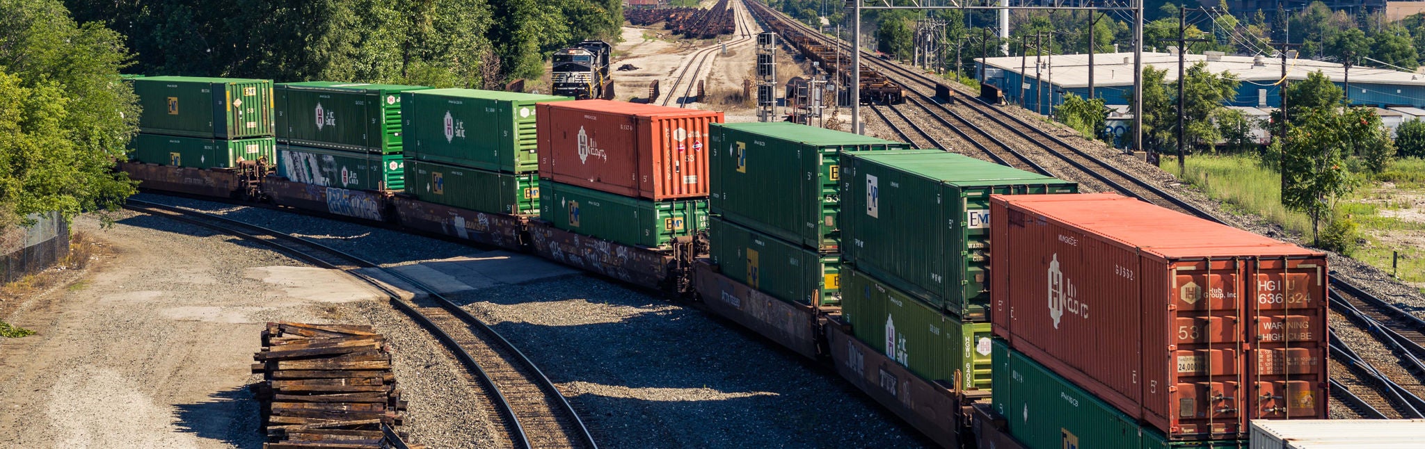 Stacked intermodal shipping containers stationed at a Norfolk Southern intermodal facility.