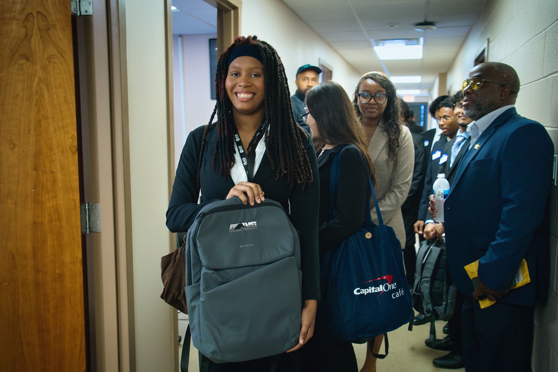 Always Giving Back Foundation participant holding Norfolk Southern backpack