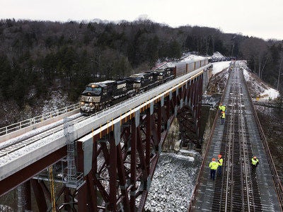 At 2:20 p.m. Monday, Norfolk Southern general merchandise train 36T became the first to cross the new Portageville Bridge. (PRNewsfoto/Norfolk Southern)