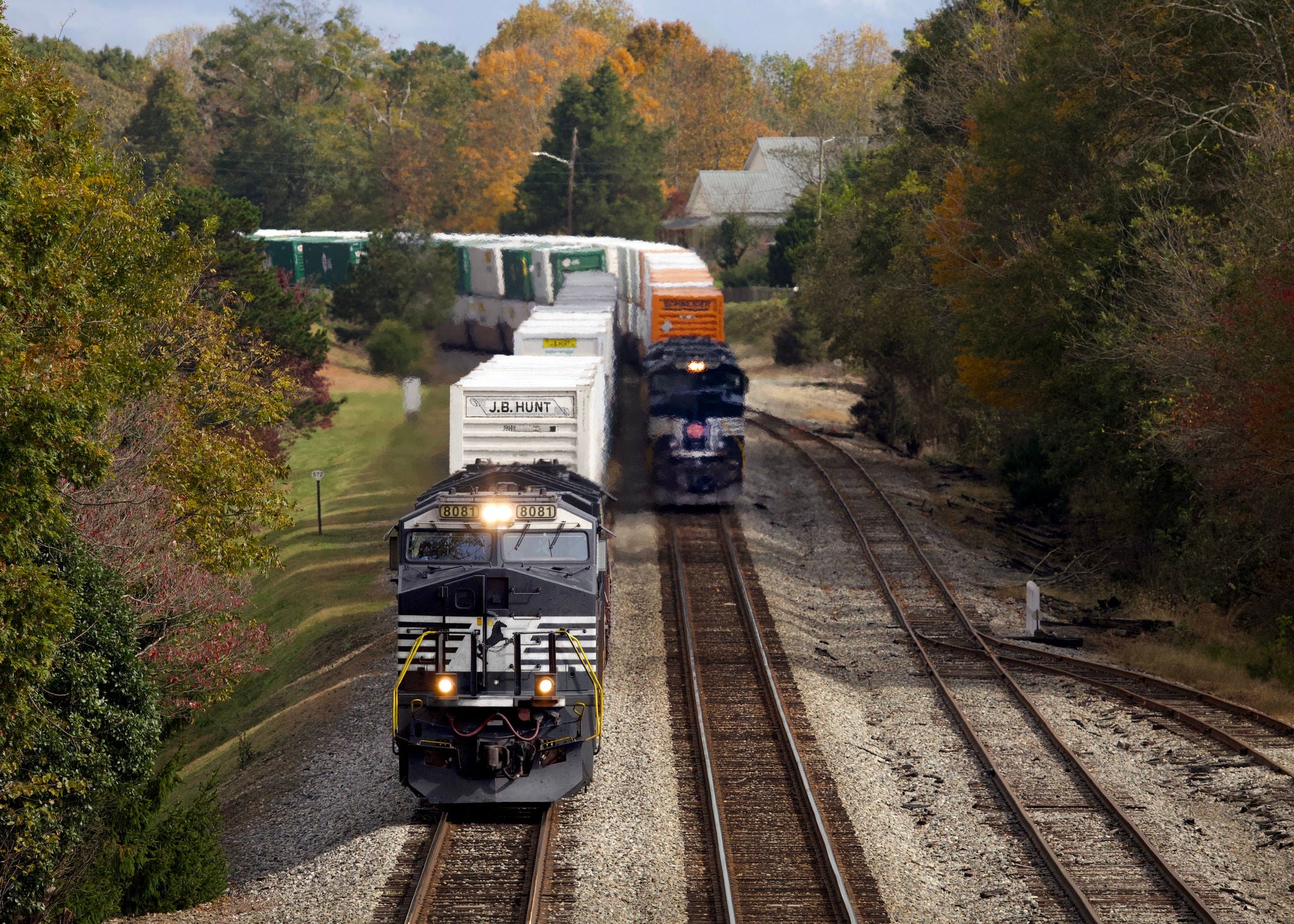 203 passes 211 on the double track at Lula as the two premium trains make a run for Inman Yard.Speeding intermodal car velocity, delivering for our customers
