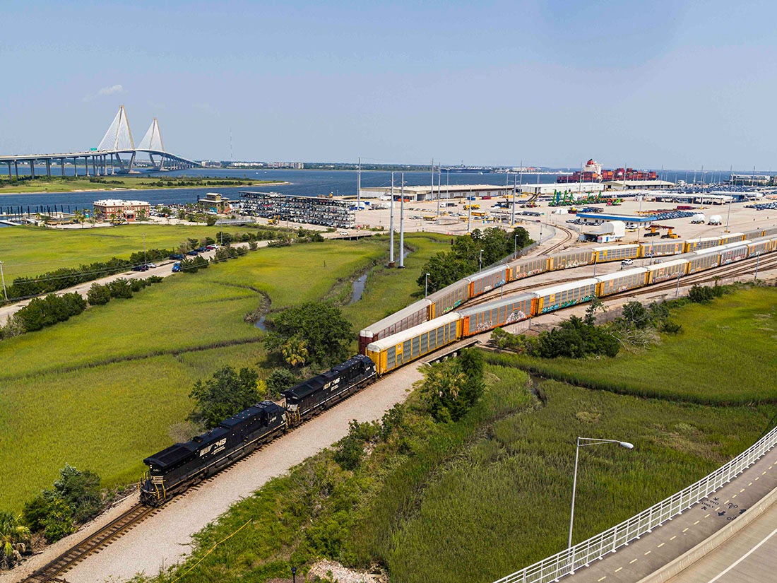 Overhead shot of auto rack consist leaving the Port of Charleston, Ravenel bridge in distance.