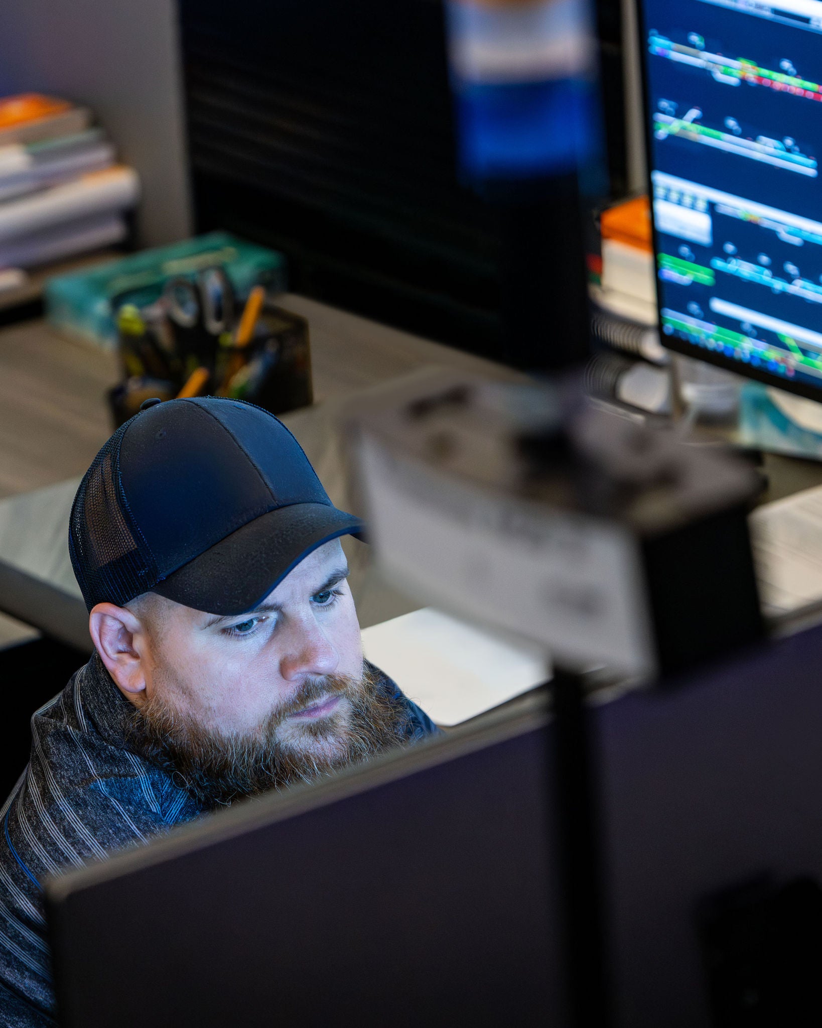 A Norfolk Southern dispatch employee monitors his computer applications in service of the railway company’s railway technology. 