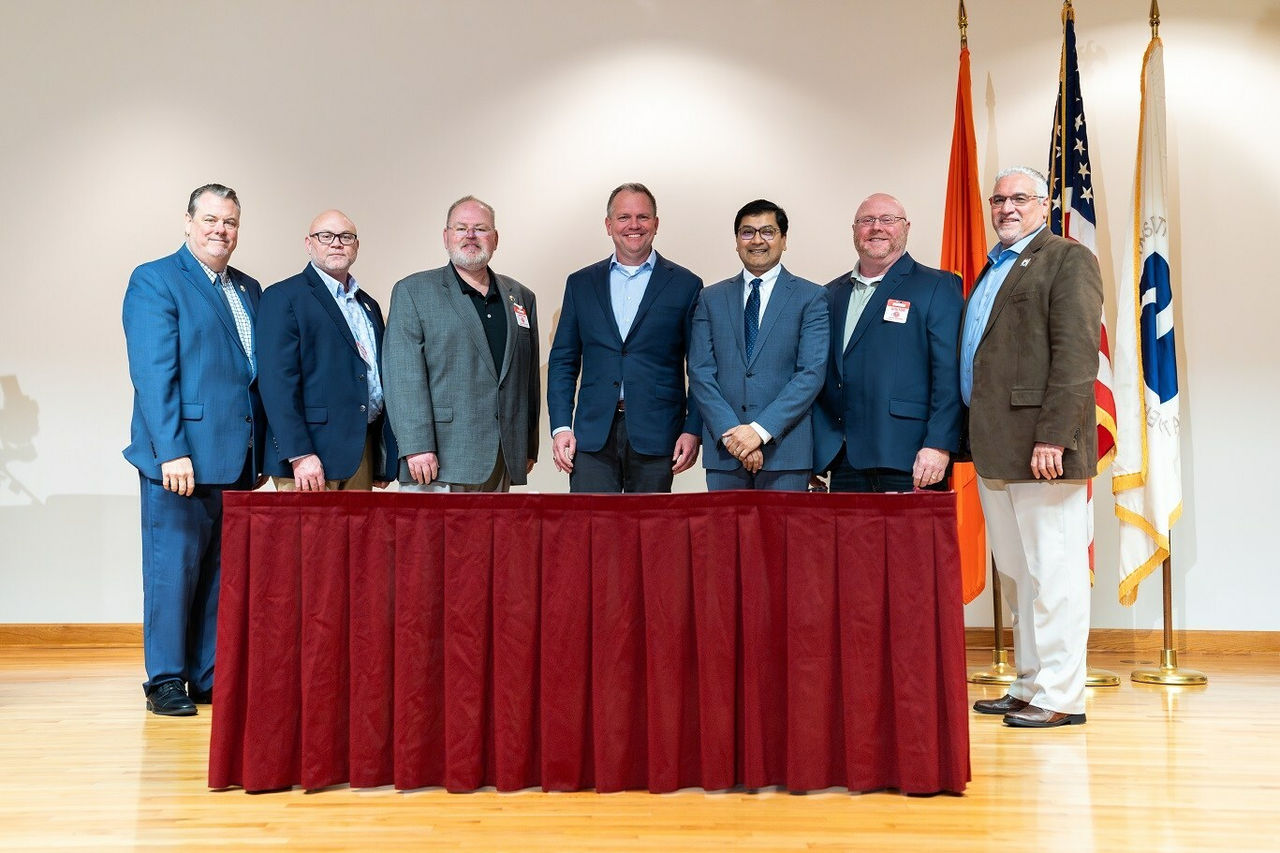 BLET union leaders, Norfolk Southern President & CEO Alan Shaw, and FRA Administrator Amit Bose.