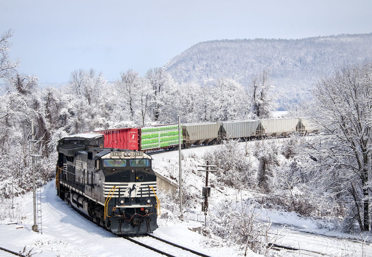 mixed-freight train 11R rolls into snow-covered Marysville, Pa.,The magic behind the season: Norfolk Southern delivers the holidays