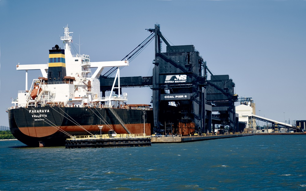 A ship takes on coal at Pier 6, the heart of Lamberts Point Coal Terminal in Norfolk, VA. The facility operates around the clock. Since 1883, more than 1.2 billion tons of coal have been loaded onto vessels there. Patterson's photo illustrates how Norfolk Southern moves the economy every day.Lamberts Point team sets coal processing record