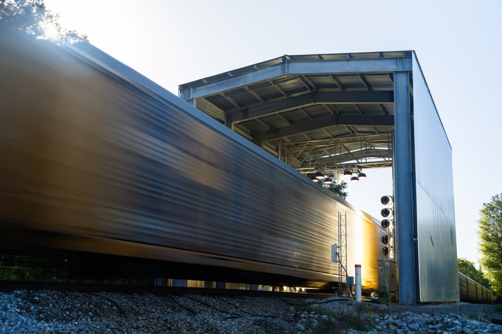 Norfolk Southern unveils a new automated train inspection portal near Jackson, Georgia, using advanced technology to prevent railway issues and ensure safe train operations.JACKSON-DTI-037_RT