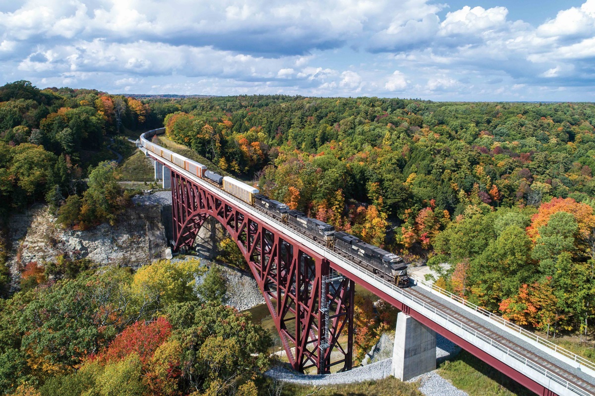 Crossing the massive Genesee Arch Bridge in Letchworth State Park, Portageville, NY. NS train 310 makes its way from Buffalo to Binghamton, NY. October 13, 2020Northern Region fast-tracks safety and <br />performance gains
