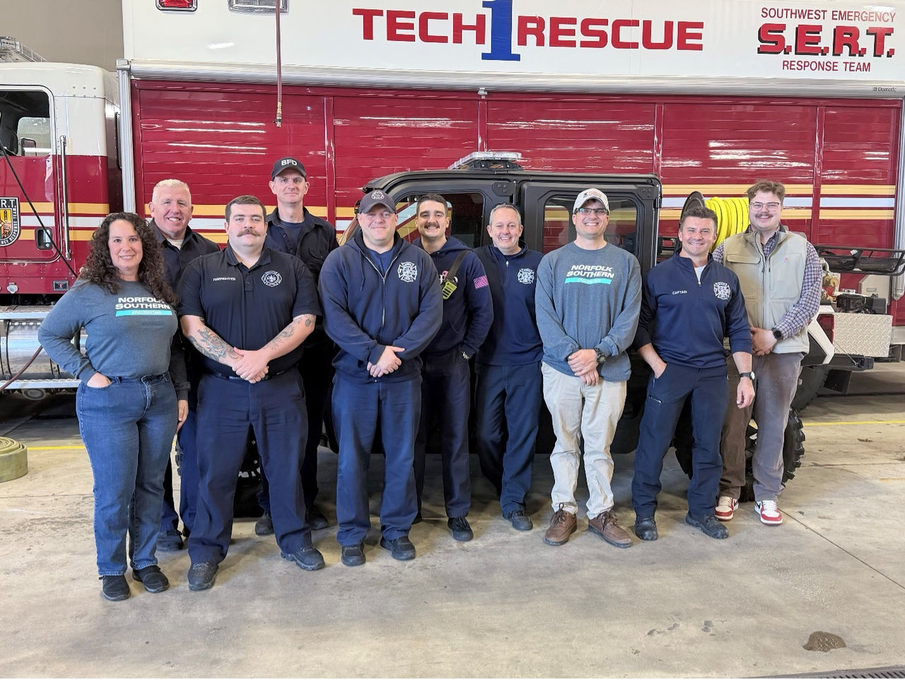 Brooklyn, Ohio FD and NS railroaders standing beside a fire truck