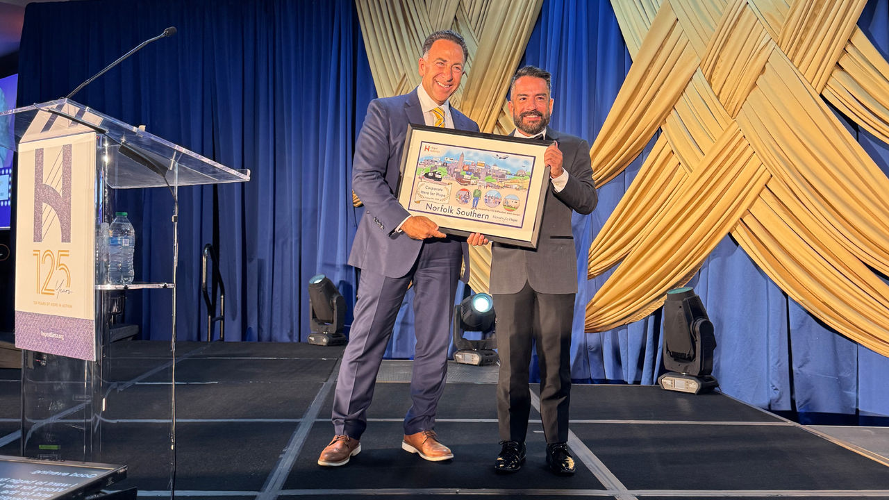 Norfolk Southern President and CEO Mark George accepting award