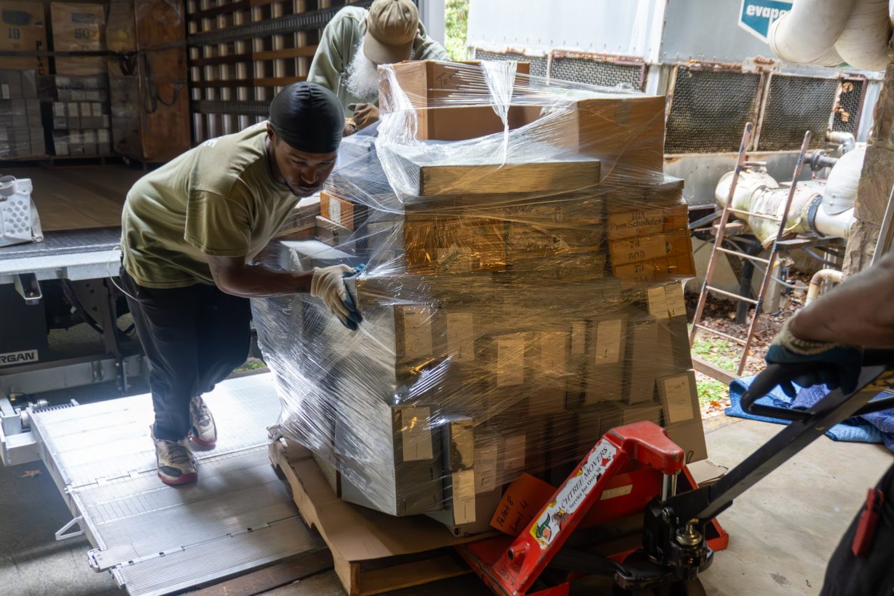 image of boxes on a pallet being moved off a truck